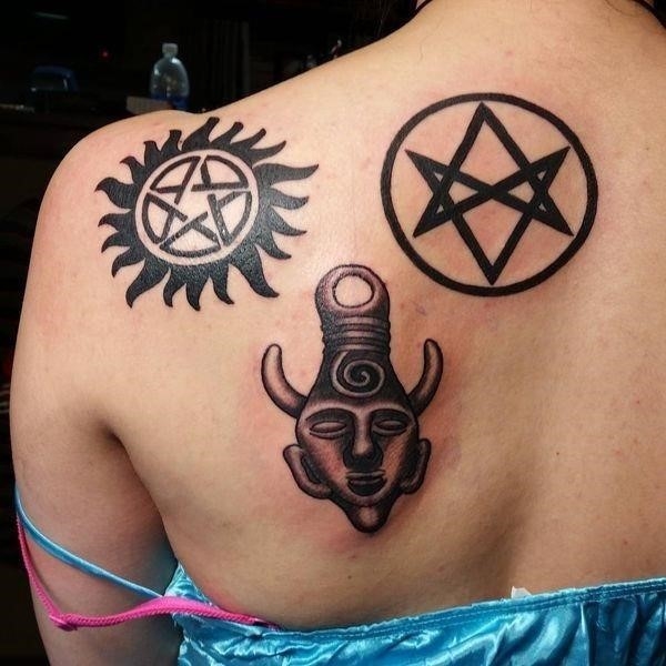 21 Three “Supernatural” symbols tattoo on the shoulder blade