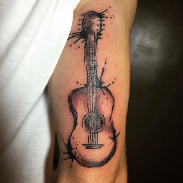 Acoustic Guitar Tattoo on Tricep by grovetattoo