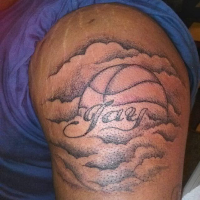 Basketball In Clouds With Hay Text Tattoo On BiceP