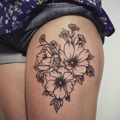 MInimalist lotus flower tattoo on the hip