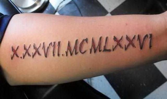 Birthday Date In Roman Numerals Tattoo On Forearm