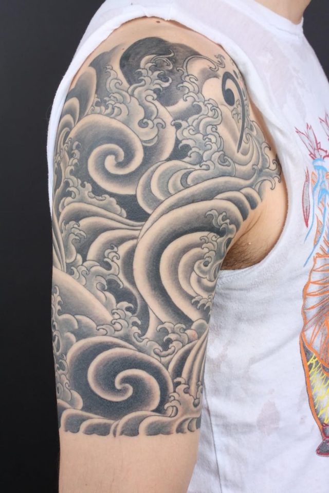 Black And Grey Japanese Cloud Tattoo On Right Half Sleeve