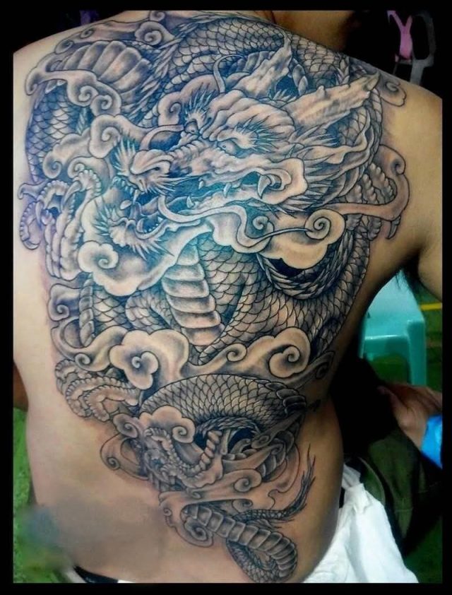 Black Ink Dragon Tattoo On Man Full Back