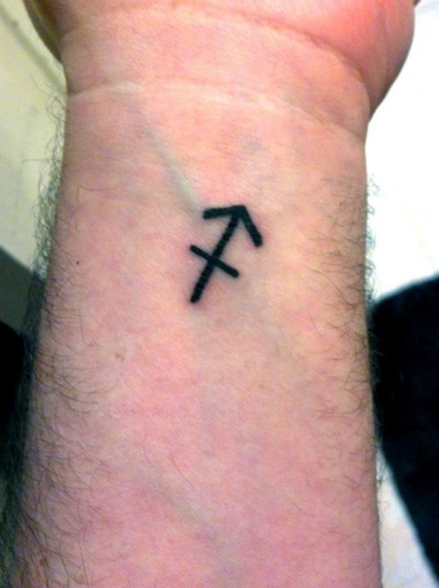 Black Sagittarius Zodiac Sign Tattoo On Left Wrist