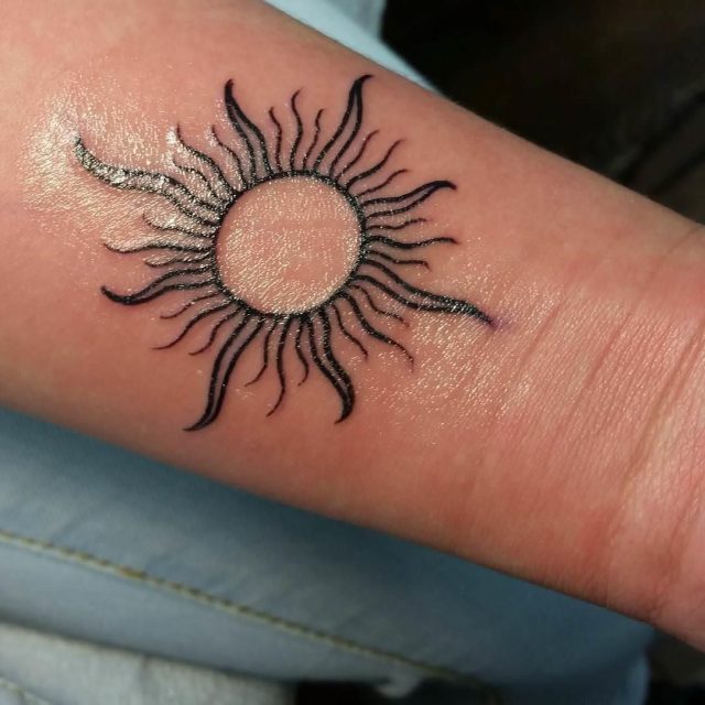 Black Sun Tattoo On Wrist