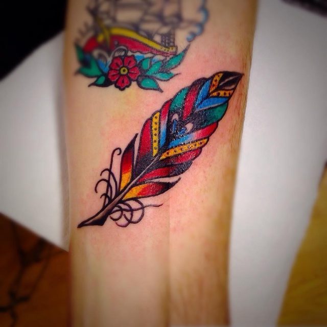 Bold lines feather tattoos