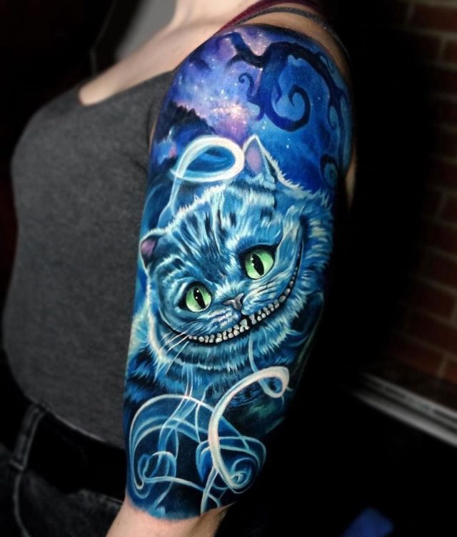 Cheshire Cat arm tattoo