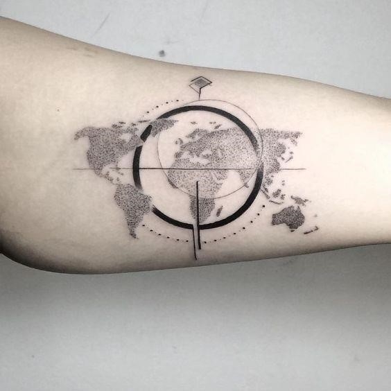 Dot work world map and compass tattoo