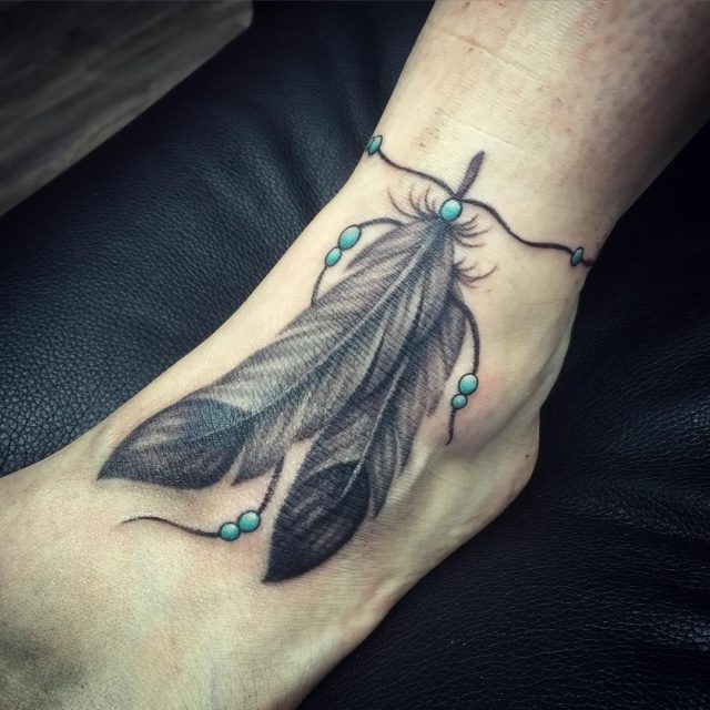 Feather tattoos on feet