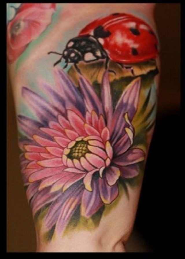 Floral Flowers And Ladybug Tattoo On Inner Bicep