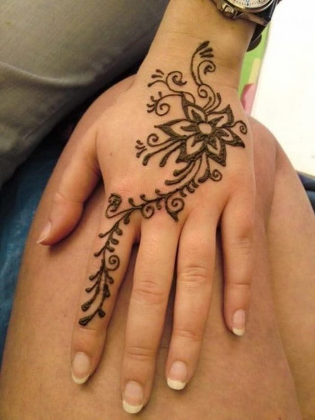 Floral henna tattoo design On Back Hand