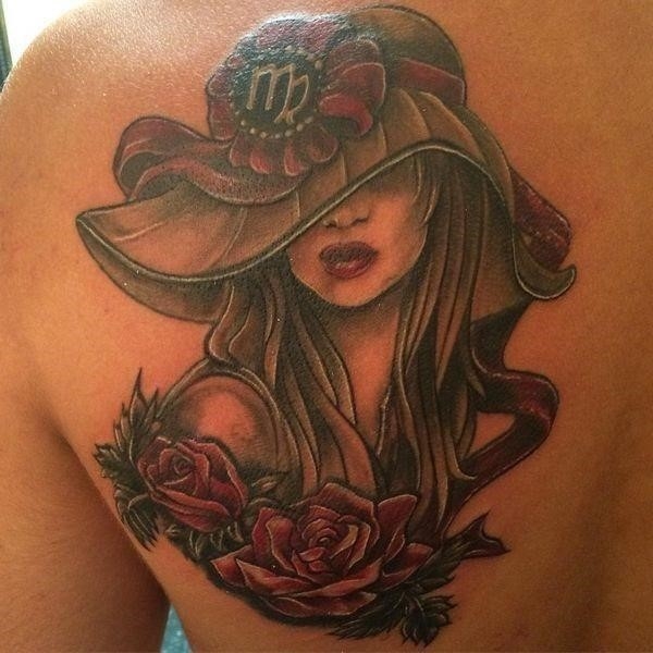 Girly shoulder blade tattoo of a Virgo woman