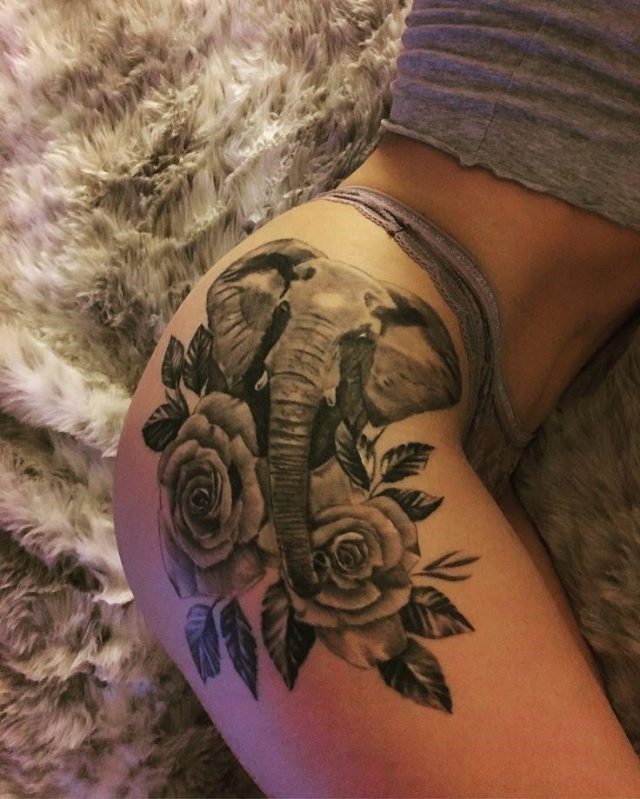 Grey Elephant With Rose Flowers tattoo On Thigh