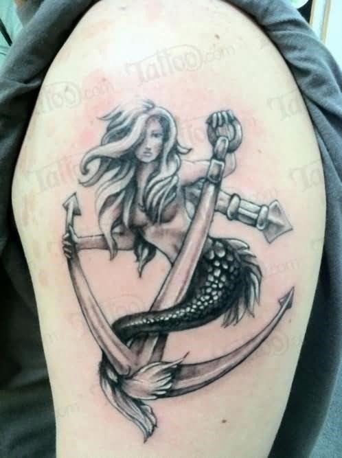 Grey Ink Anchor And Mermaid Tattoo On Left Shoulder
