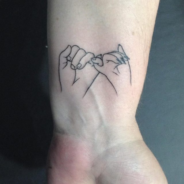 Linear pinky promise tattoo