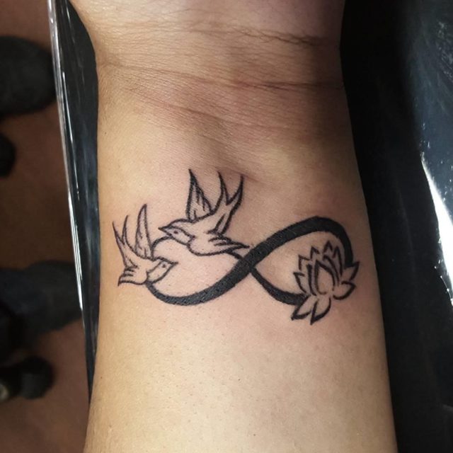 Lotus And Flying Birds Infinity Tattoo on Wrist