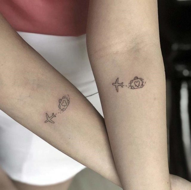 Matching travel themed tattoos