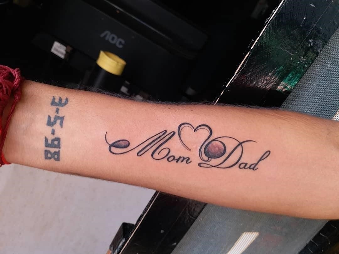 Beautiful Mom Dad with feather Tattoo... - Ink fixer Tattooz | Facebook