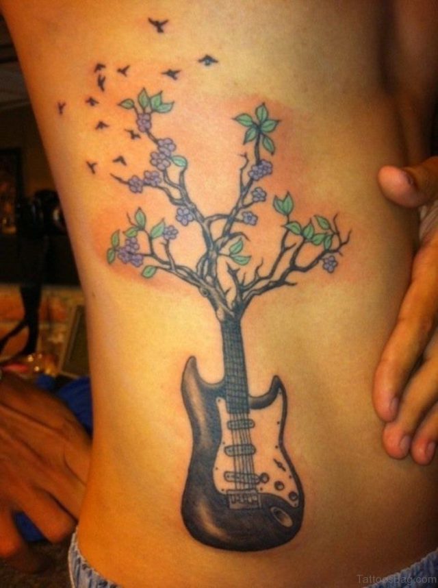 Nice Tree Shaped Guitar Tattoo On Rib Side