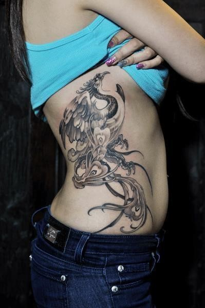 Side rib phoenix tattoo
