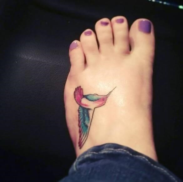 Hummingbird tattoo done on the ankle microrealistic