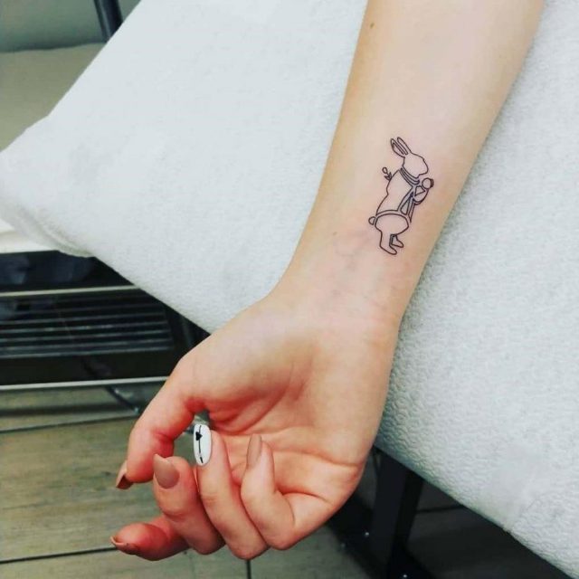 Small Wrist Tattoo Hug e1593469303409