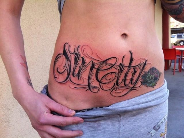 Suncity Lettering Tattoo On Girl Stomach