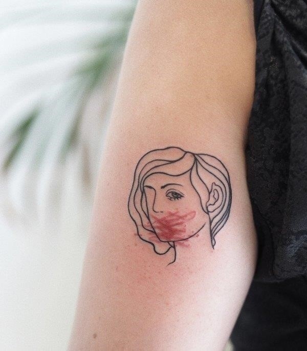 Wonderful line work feminist tattoo