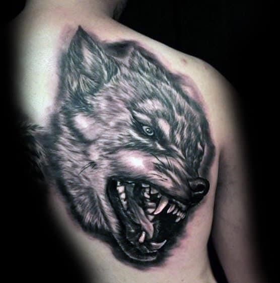 Agressive wolf guys back tattoo