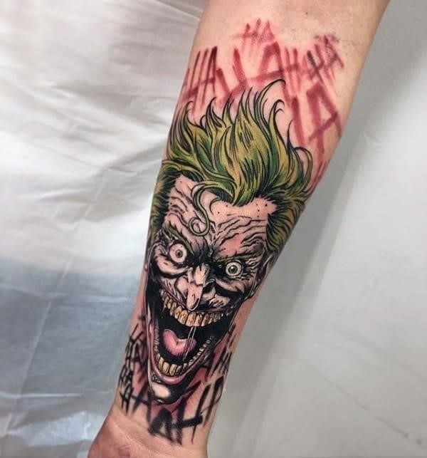 Artistic male joker inner forearm tattoo design inspiration