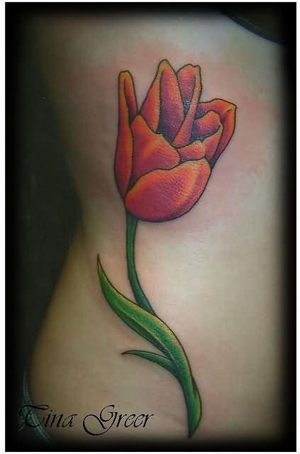 Attractive girl rib side tulip tattoo