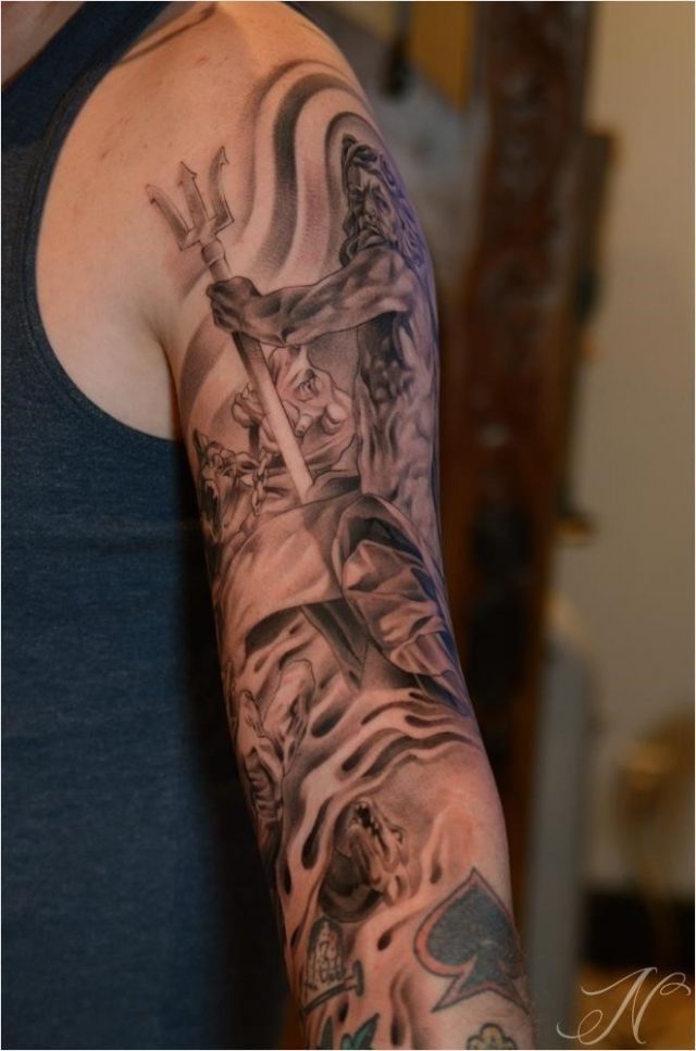 Awesome grey ink greek tattoo on man left sleeve