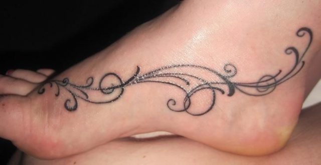 Awesome grey ink swirl foot tattoo