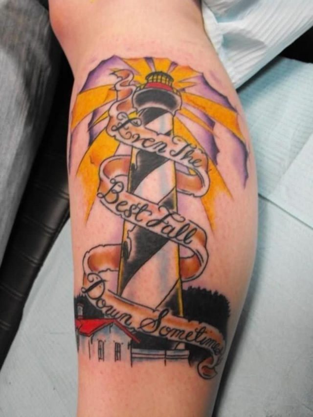 Banner and lighthouse tattoo on leg