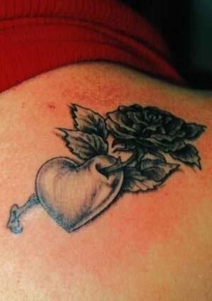 Beautiful grey ink heart tattoo