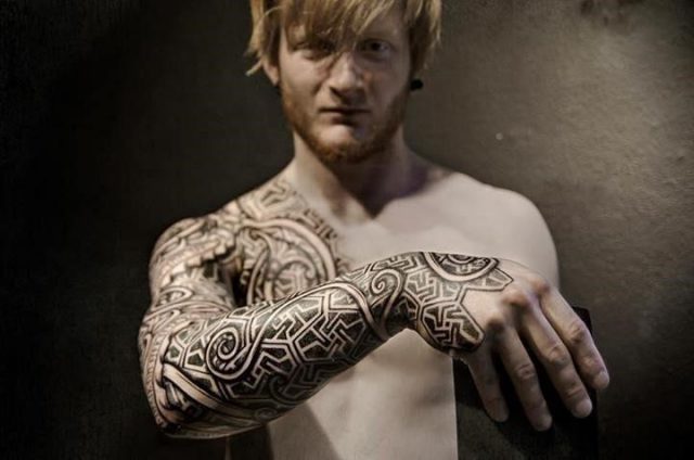 Beautiful grey ink viking tattoo on right sleeve