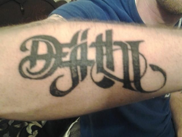 Black ink death and life ambigram tattoo