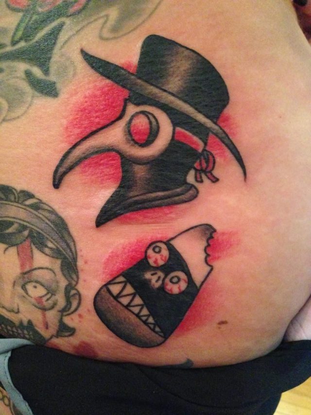 Black ink halloween tattoo on shoulder