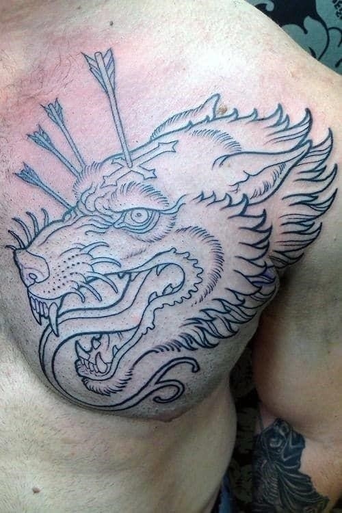 Black ink outline wolf with arrows male upper chest tattoos