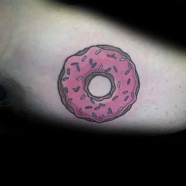 Classic police doughnut tattoo on inner arm bicep