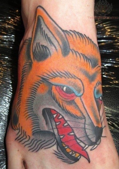 Color fox head tattoo on foot