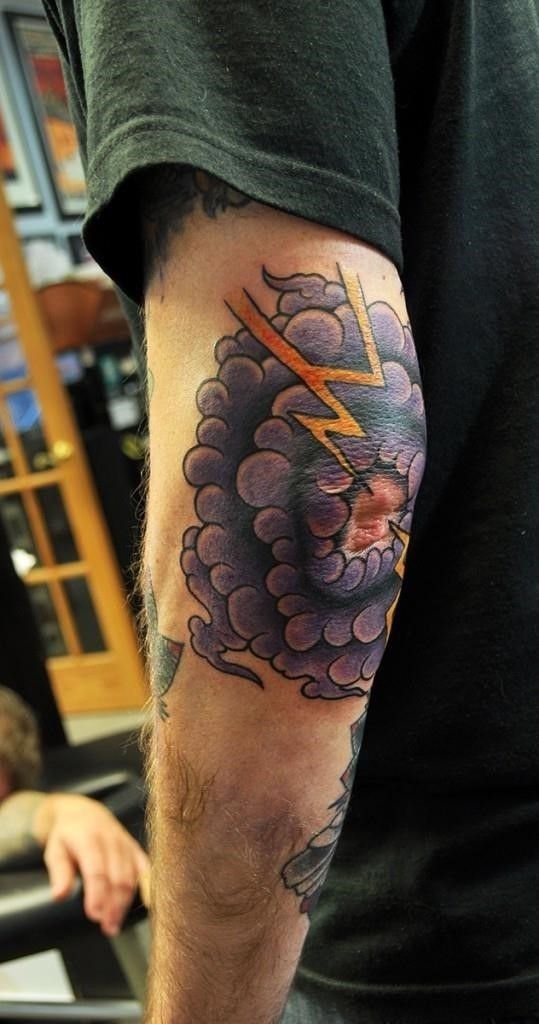 Colored cloud elbow tattoo