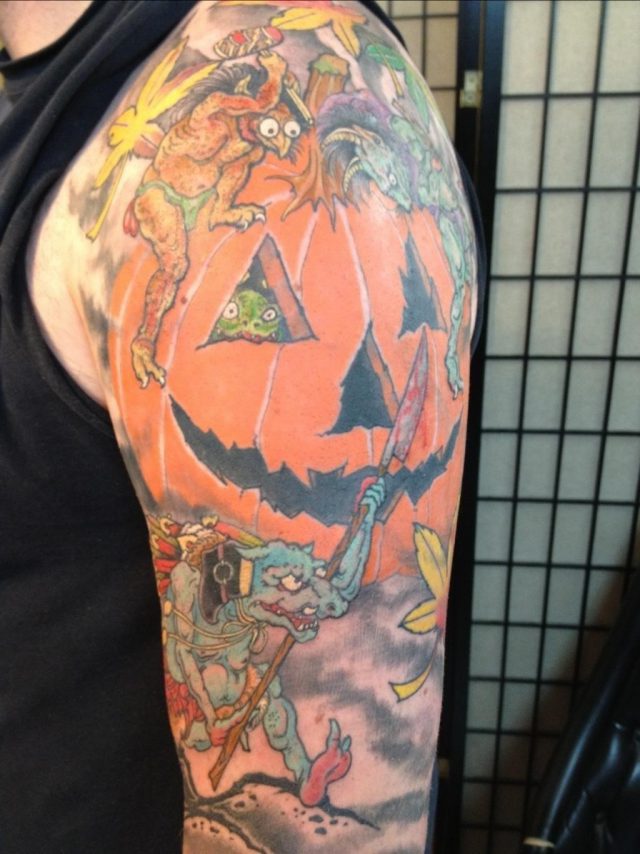 Colored halloween tattoo on left half sleeve