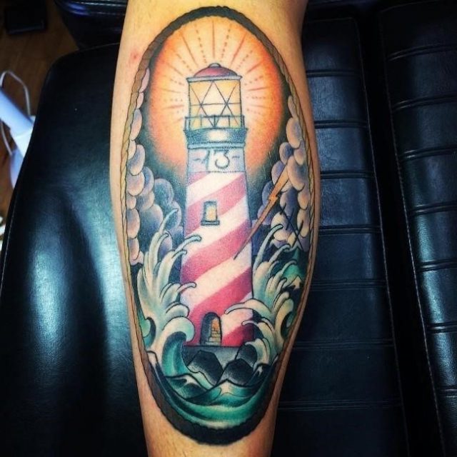 Colored lighthouse leg tattoo for men