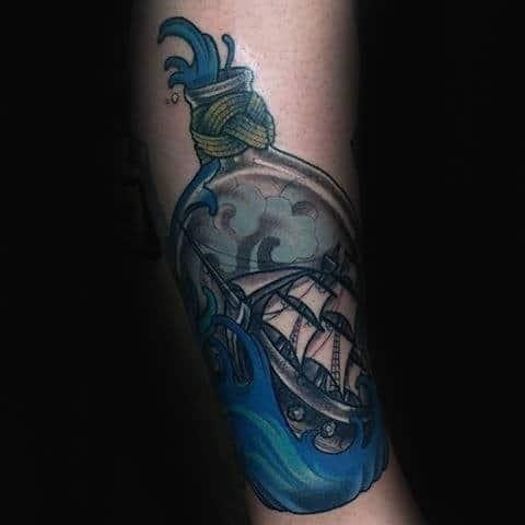 Detailed blue ink ship in a bottle arm tattoos for guys