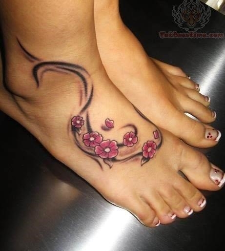 Feminine tattoo on foot