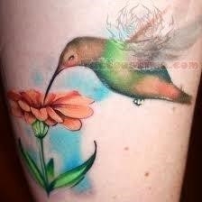 Flowers and hummingbird tattoo
