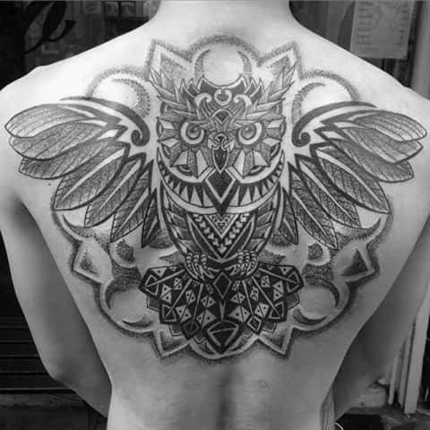 Flying geometric owl feathers mens back tattoo
