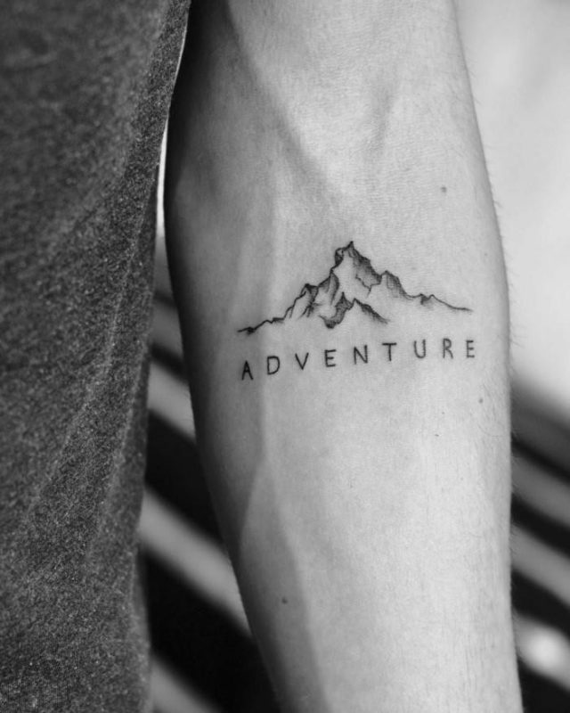 Forearm tattoo mountain tattoo sleeve minimalist mountain range adventure written under it