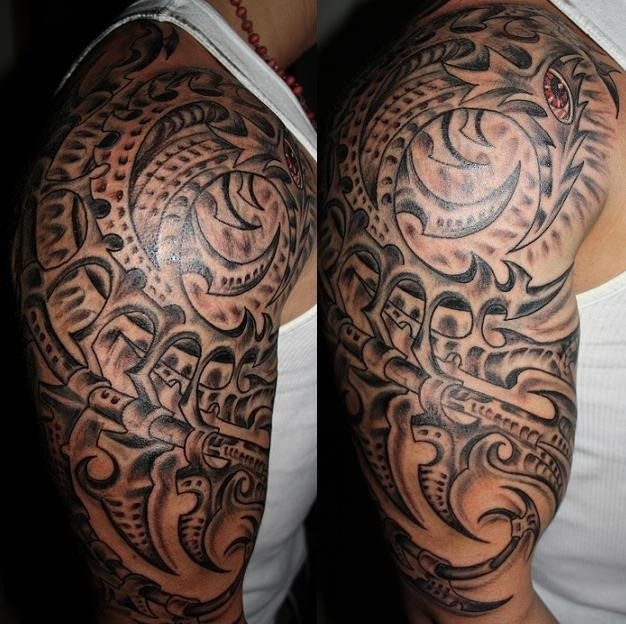 Grey ink bio mechanical tattoo on right half sleeve